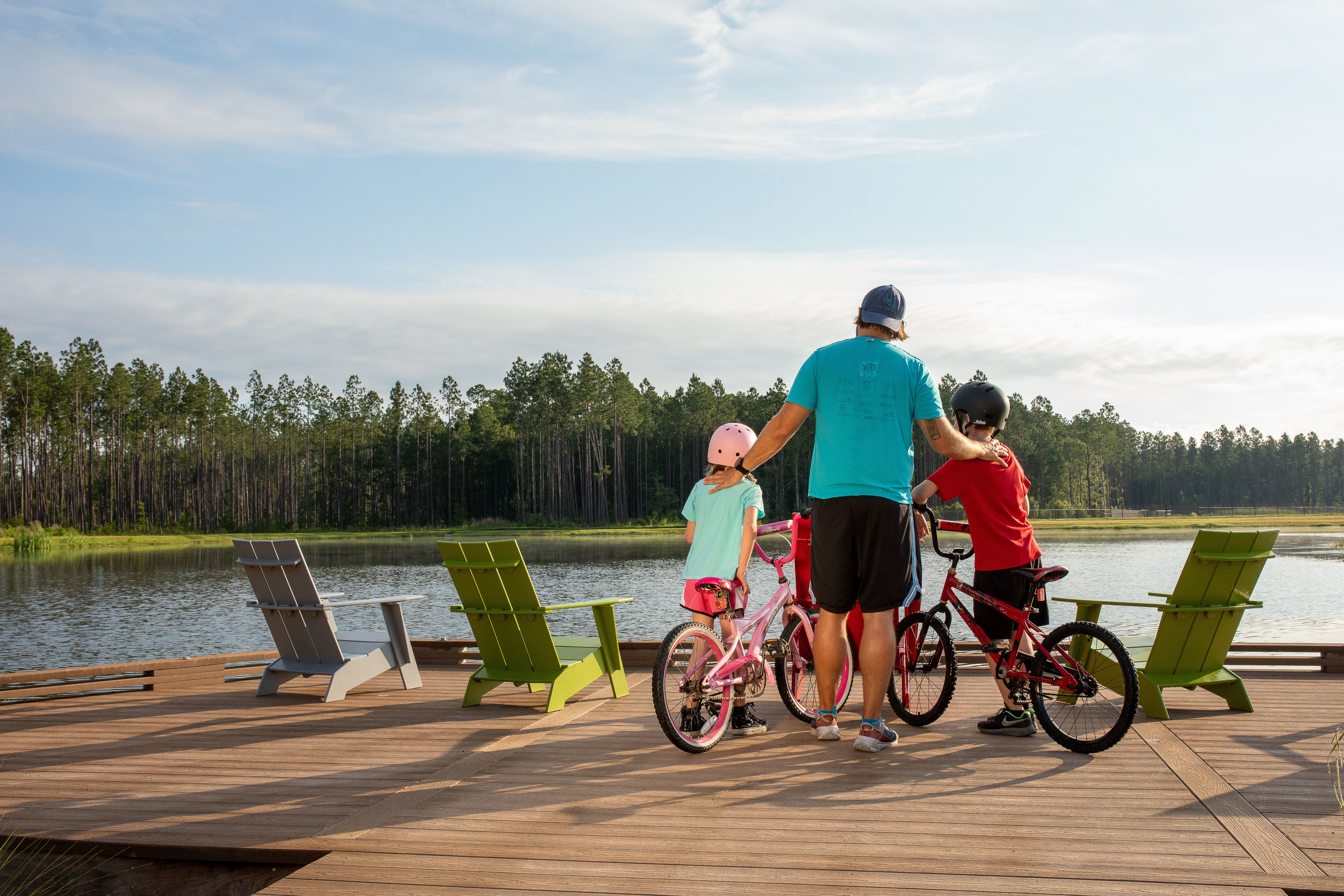 young family biking on wildlight bike trail